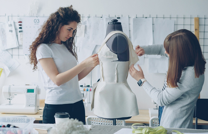 fashion designers working in their workplace