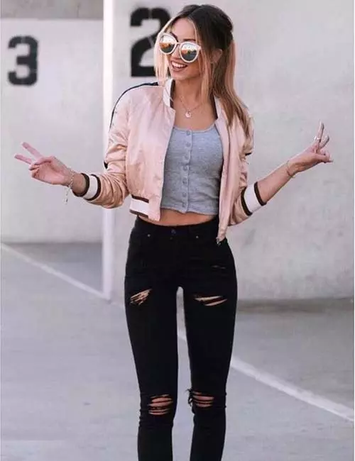 Black jeans with crop top and denim jacket