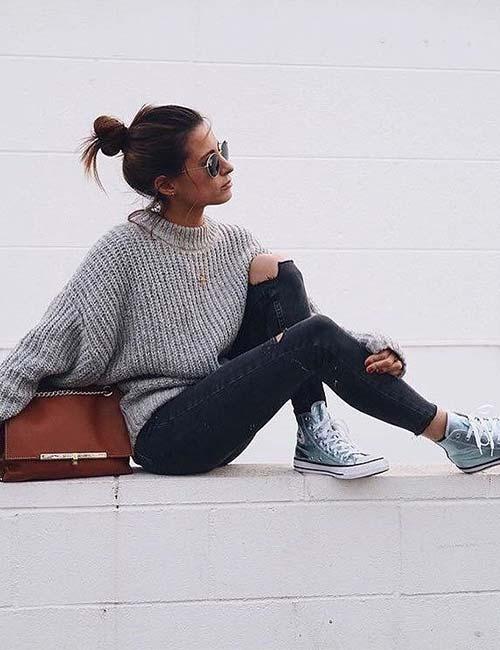 Black jeans with distressed jeans and oversized sweater