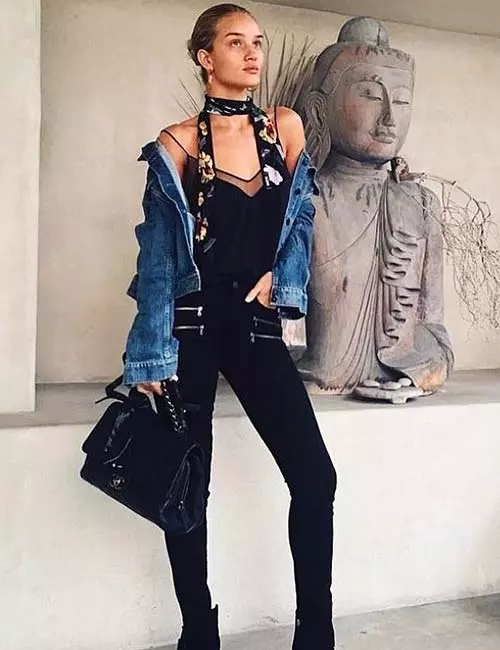 Black jeans with noodle strap top with denim jacket and boots
