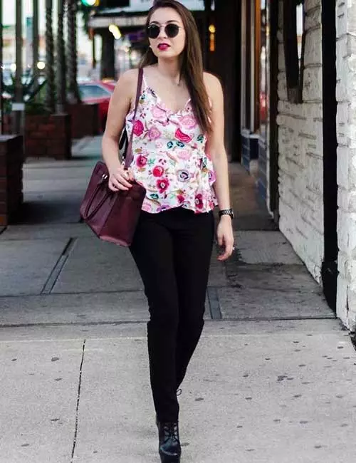 Black jeans with a floral tank or ruffled top