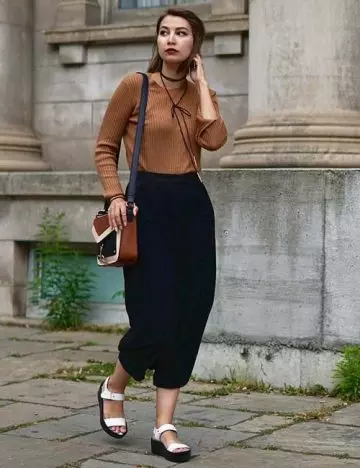 Wear your culotte pants with a tucked in sweater