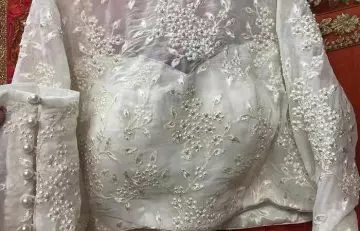 Pearl patch work on a white blouse with sweetheart neck design