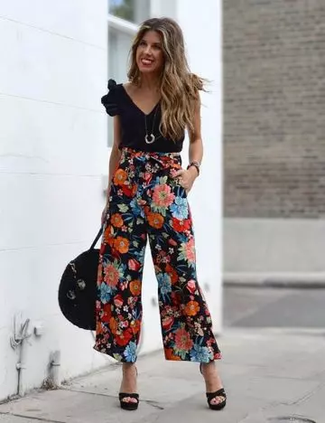 Style your floral culotte pants with a simple black top