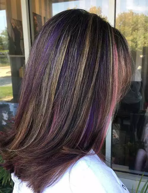 Subtle blonde and purple highlights for dark hair
