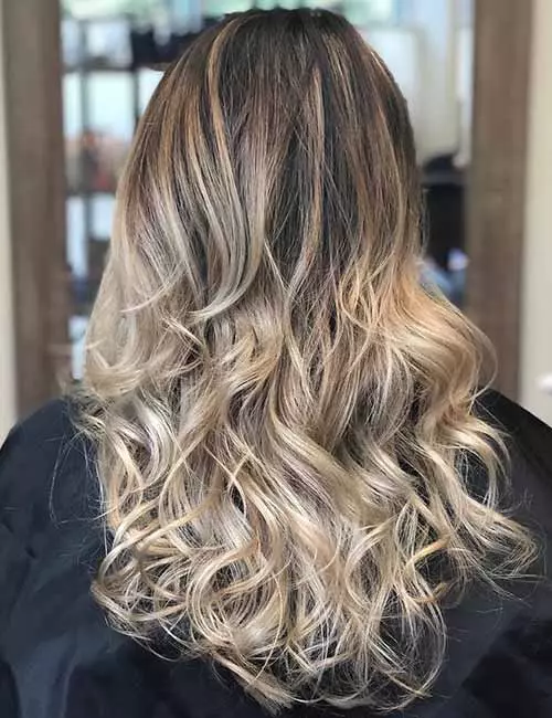 Ash blonde highlights and balayage combine to create contrast and depth