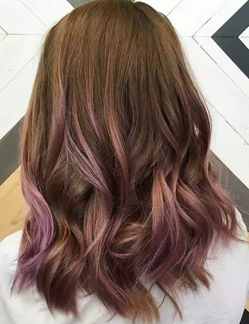 Peach toned subtle lavender ombre hair color