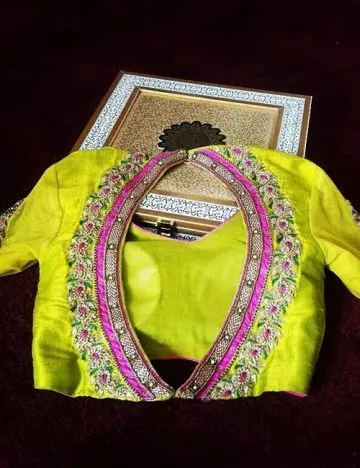 Oval shaped backless blouse design with patchwork