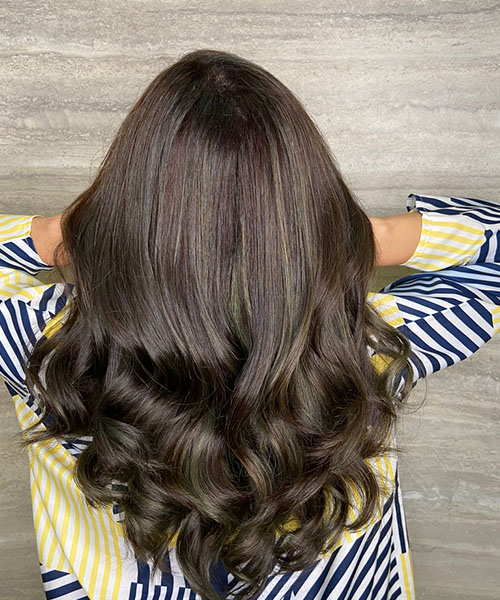 Cool-toned brown highlights for dark brown hair