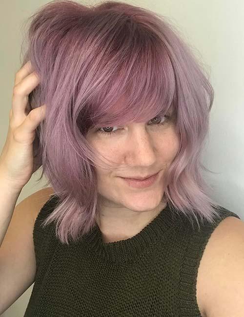 Heavy smoky purple hairstyle with side-swept bangs