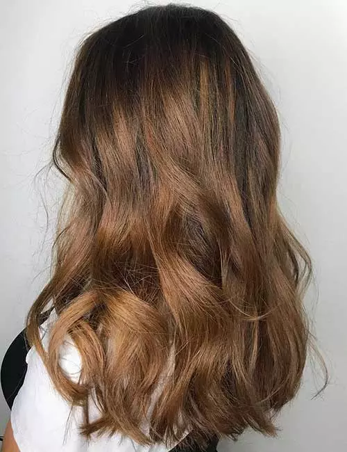 Heavy light brown balayage hair color for a natural look