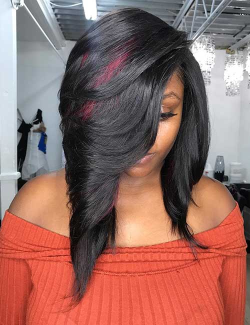 Layered long bob with peek-a-boo highlights sew-in hair