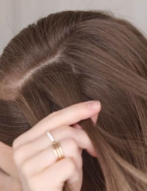 Pick up a section of hair and divide it into 3 sections