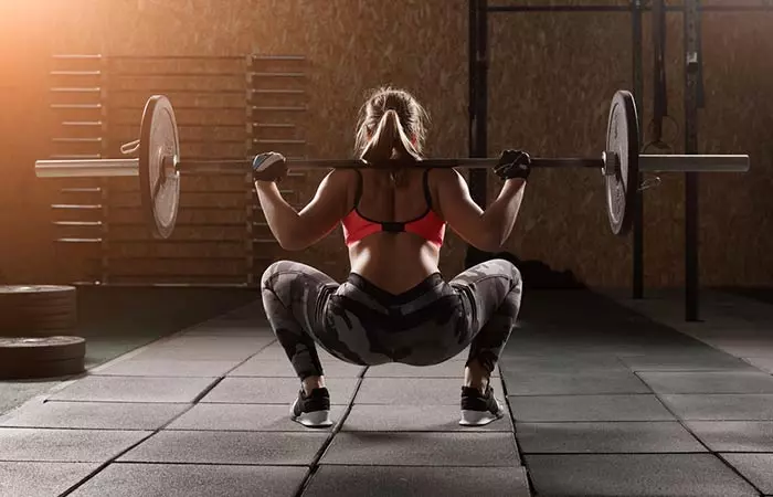 Barbell sumo squat targetting shoulders and other body parts