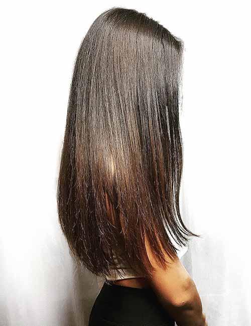 Subtle ombre fade hair color on dark hair