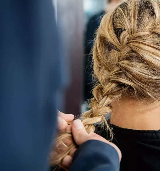 Tie the ends of the French braid with another hair elastic