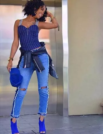 Tapered mom jeans with a bodycon top and boots