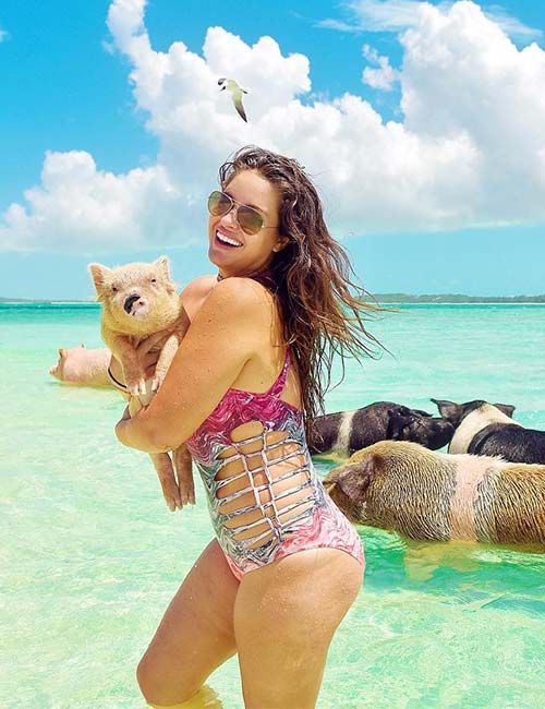 Plus size model Lexi Placourakis at the beach with her pets