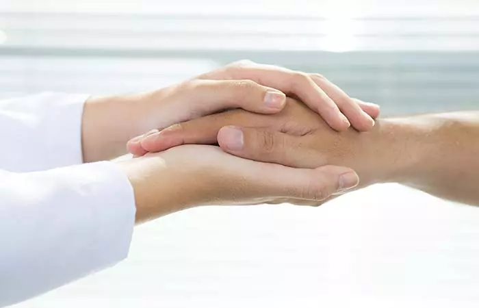 10. Palm Sandwich Handshake