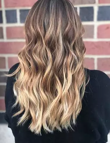 Peach toned blonde balayage hair color