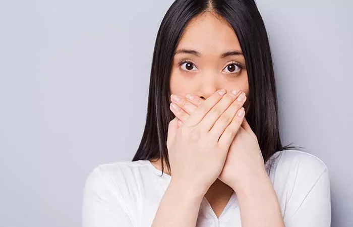 2. Mouth Covered With Hand