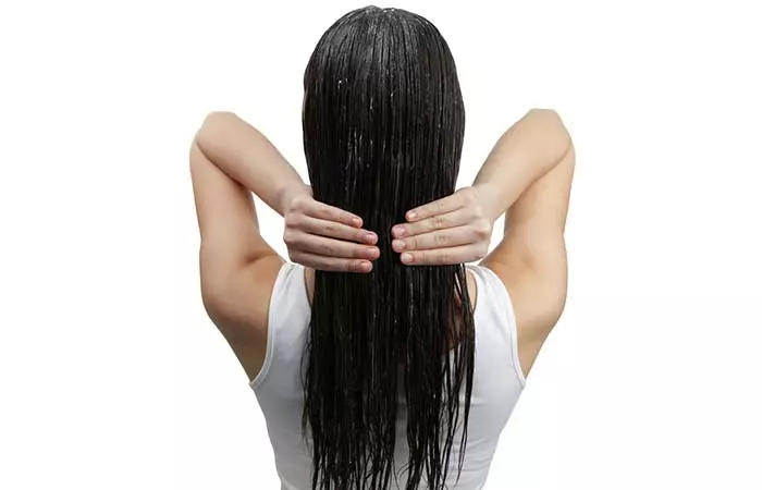 Apply coconut oil before swimming to protect hair color