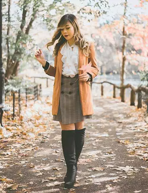 Knee high boots with a formal skirt