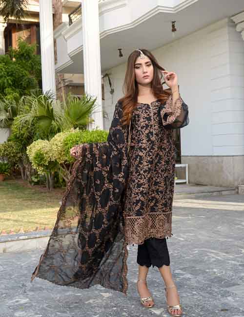 A woman wearing a black suit with a threadwork georgette dupatta 