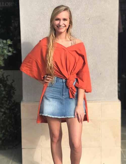 red top and denim skirt