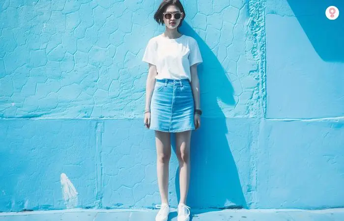 Denim skirt and white sneakers