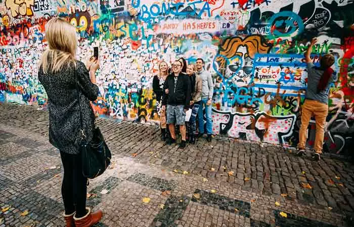 You can also ask your friend to pose with the locals.