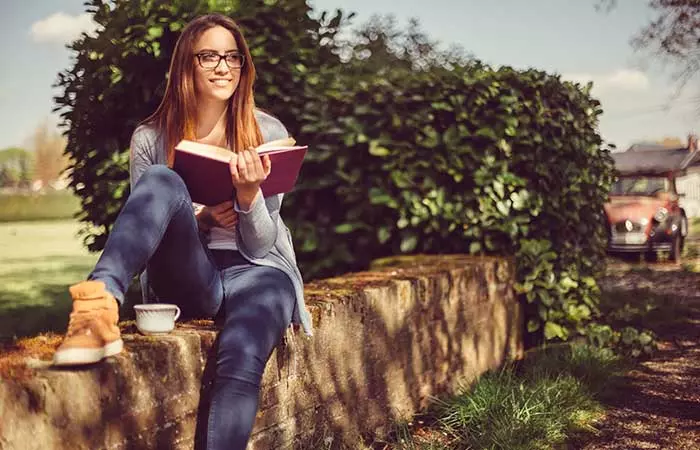 give her a book so she can pretend to be reading it.