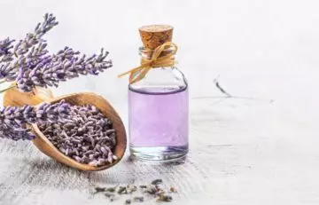Lavender essential oil in a glass bottle