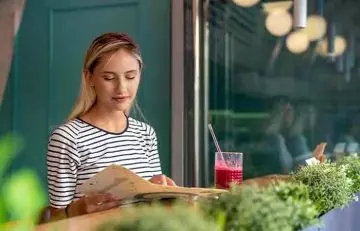 Woman enjoying a smoothie at a restaruant