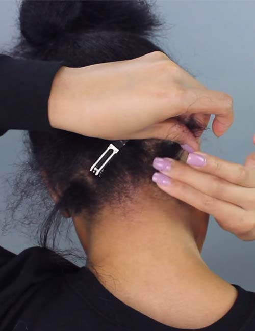 Applying edge protection cream near the scalp