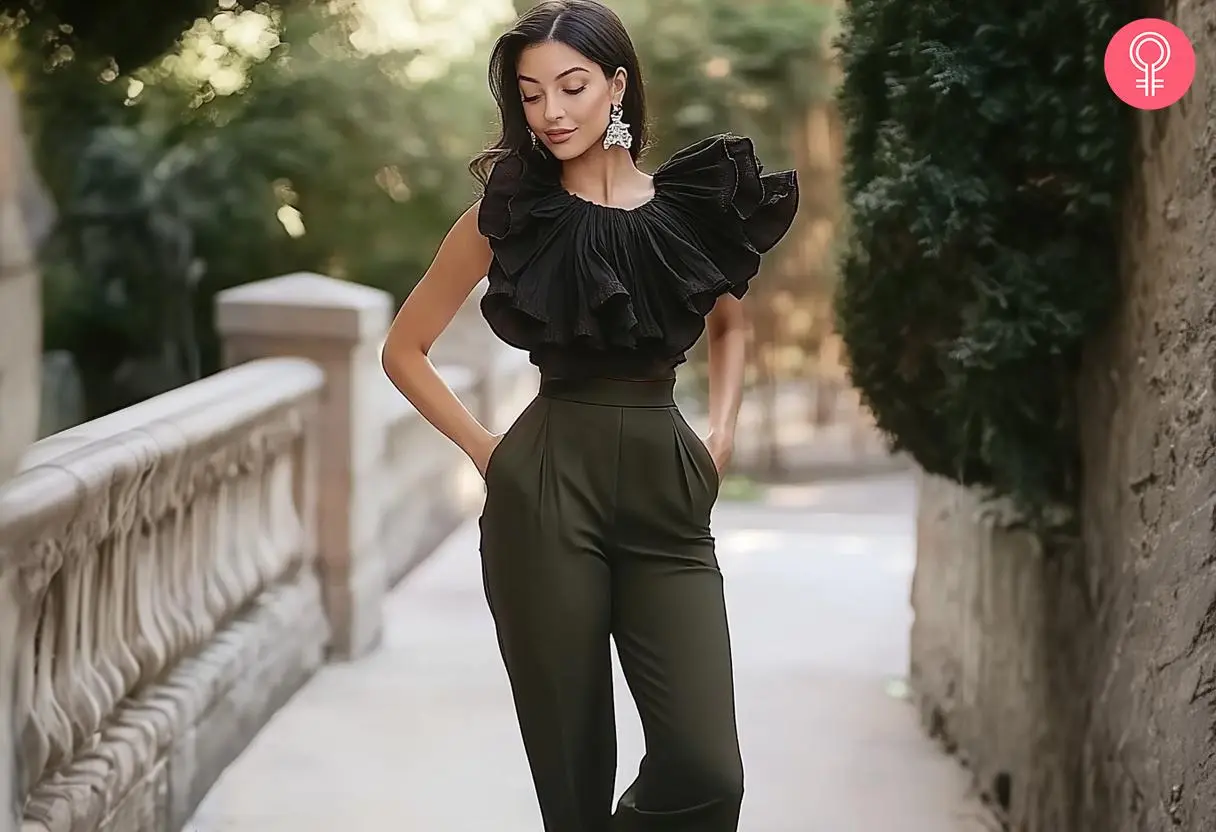 A ruffled top with high waisted olive green pants