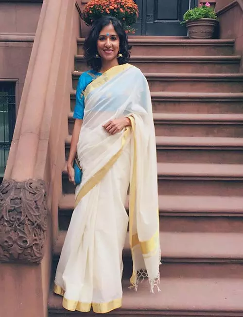 Pair Kerala saree with a blue boat neck blouse