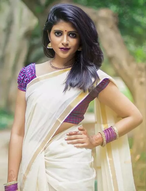 Pair Kerala saree with a checkered blouse