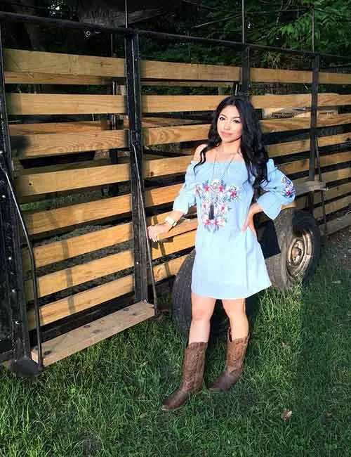 Off-shoulder dress with cowboy boots