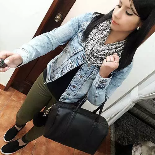 A denim jacket with olive green pants