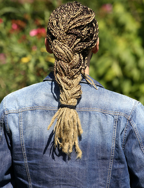 Senegalese twist hairstyle underneath a half ponytail