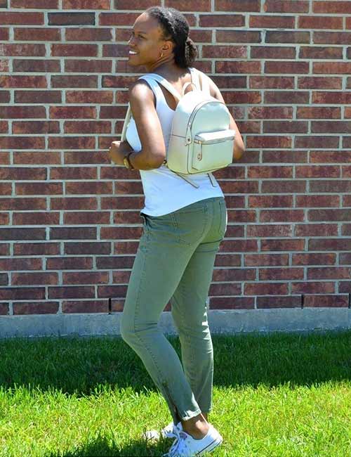 A tank top with skinny olive green pants