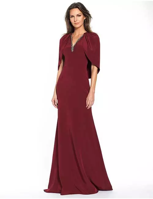Magenta gown with flap sleeves and embellishments for fall wedding event