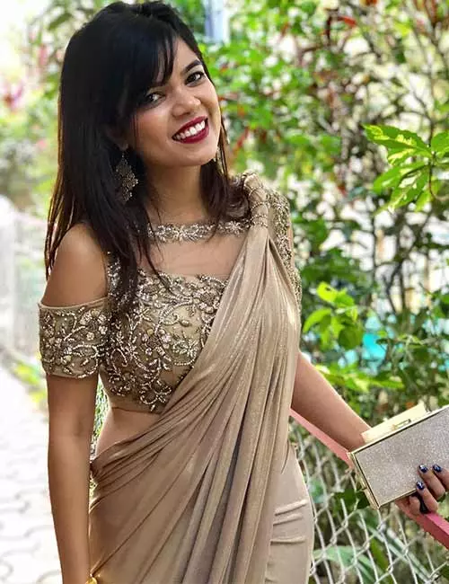 Plain golden cold shoulder blouse with a designer saree