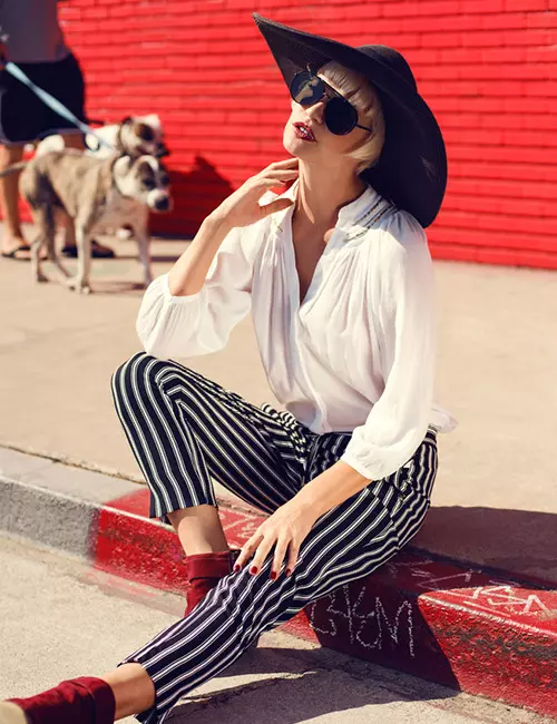Woman wearing striped pants with ankle boots