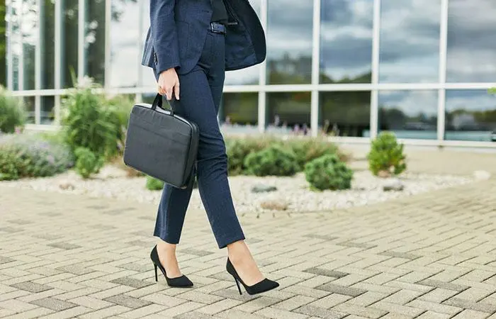 A woman walking in heels