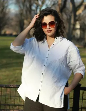 Oversized white button-up shirt with denim