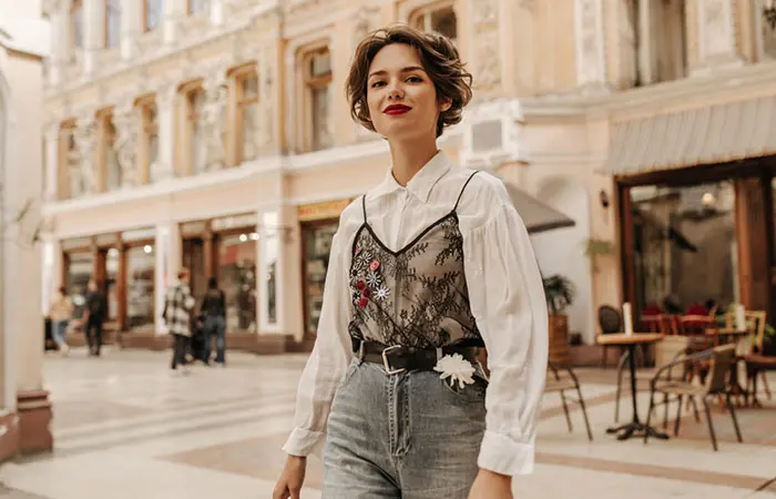 Woman in white shirt with a knitted half vest