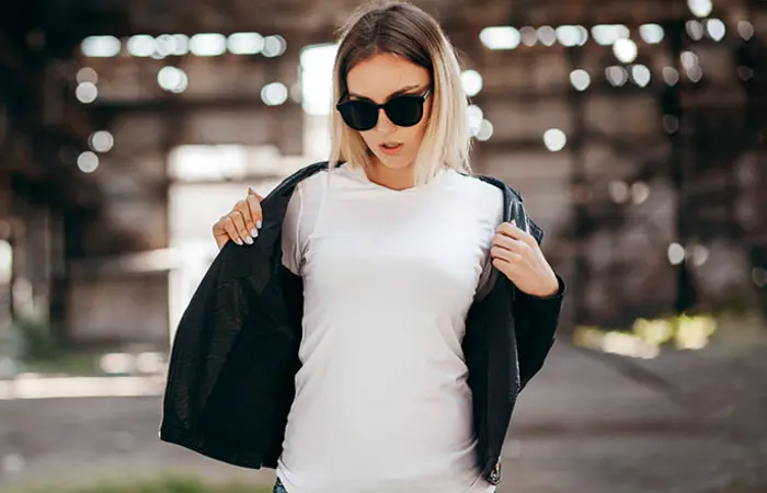 Woman in white shirt with leather jacket