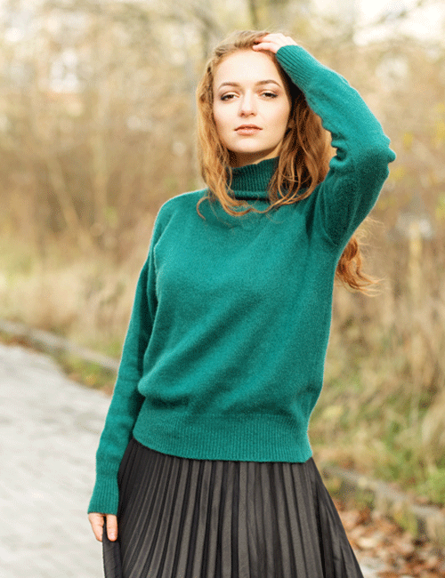 A sweater paired with a pleated skirt